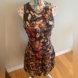 Leifsdottir Black Floral Fitted Sleeveless Dress with Red and Green Accents